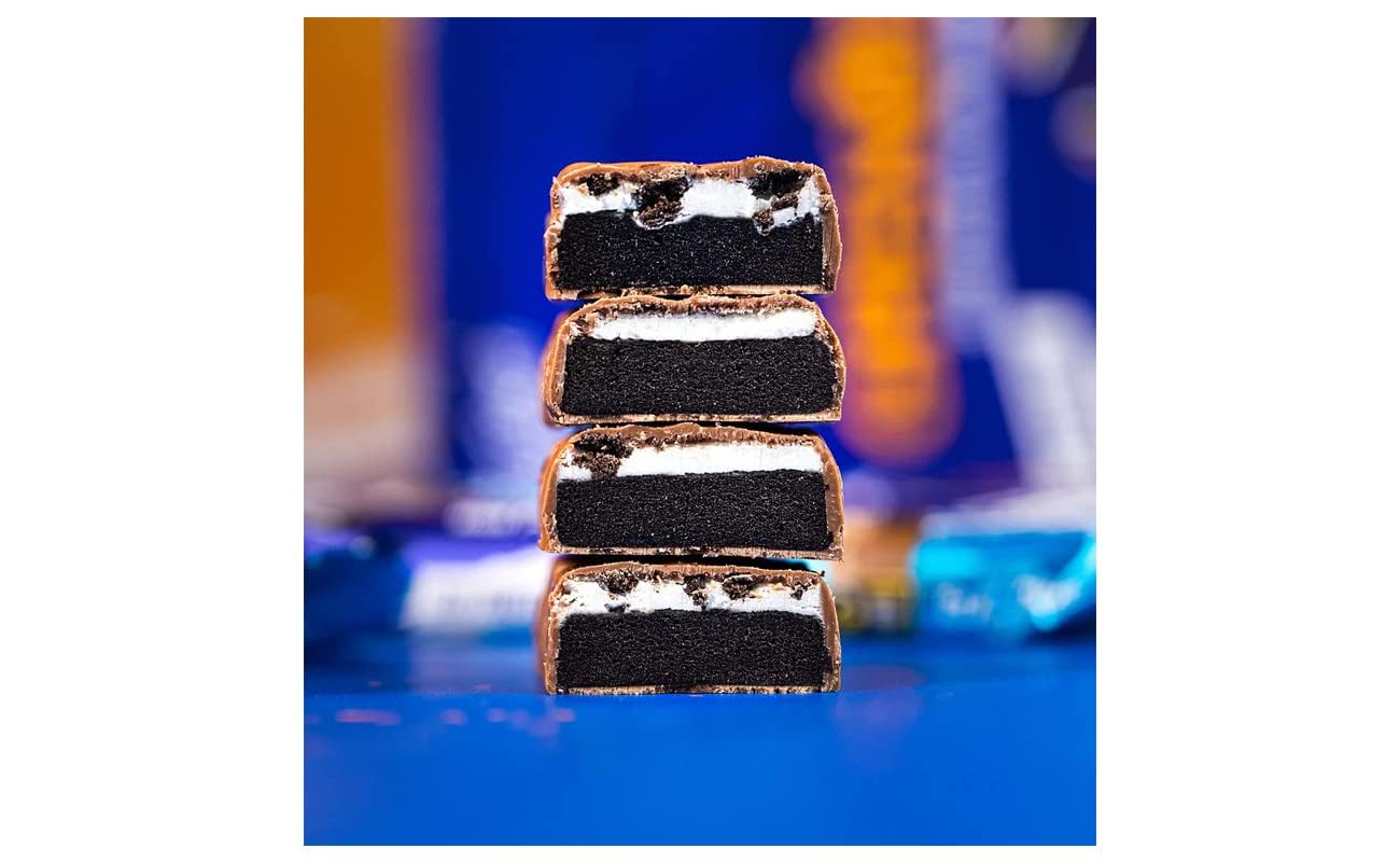 Grenade Oreo protein bars stacked cross section showing chocolate coating cookie core and cream filling