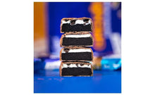 Stacked Grenade Oreo protein bar slices with white cream layer