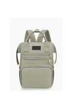 Light grey baby travel backpack front view with central label pocket