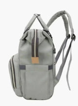 Light grey baby travel backpack with side pockets and long shoulder strap