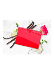 Gucci Rush EDT 75ml bottle surrounded by vanilla pods and flowers for a vibrant fragrance experience