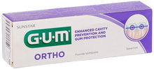 Gum Ortho toothpaste box, purple top with enhanced cavity protection design.