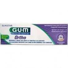 Gum Ortho toothpaste box, green and purple design on white background.