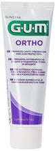 Gum Ortho toothpaste gel tube, white with green and purple branding.