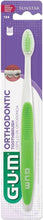 Gum orthodontic microtip toothbrush package showing soft bristle head and green handle