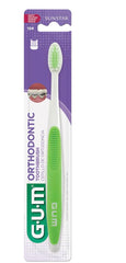 GUM orthodontic toothbrush soft bristles in green with tapered head for braces packaged brush