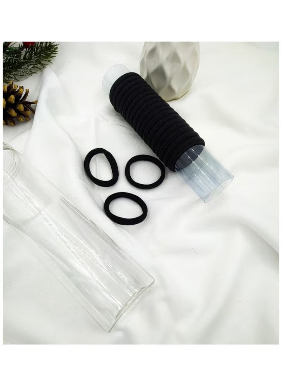 Huitich black hair ties for thick hair pack of 20 neatly stacked and displayed on white fabric
