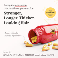 HAIRtamin red bottle with yellow capsules spilled showcasing gluten-free hair growth vitamins for thicker hair