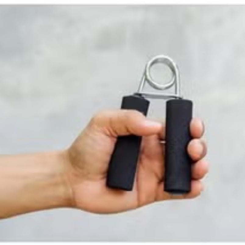 Hand holding black Huitich hand grip strengthener with foam handles for exercise