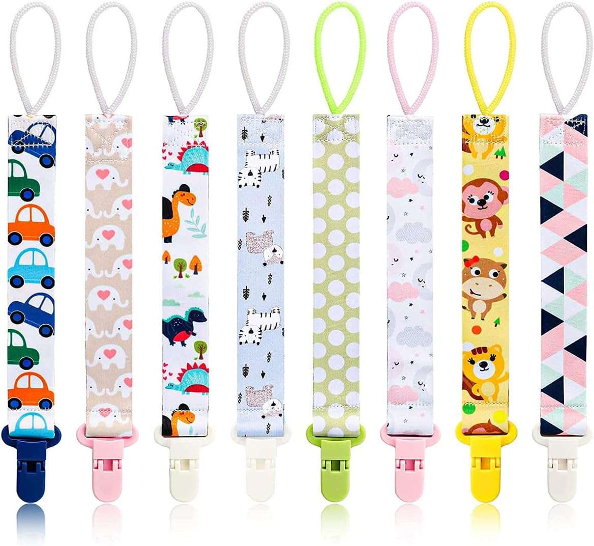 Colorful baby pacifier clips set with nine printed strap designs including cars elephants dinosaurs zebras polka dots and animals