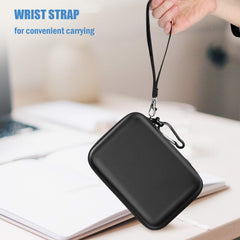Black hard disk carrying case for travel with wrist strap held by hand for convenient carrying
