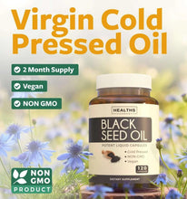 Black seed oil liquid capsule bottle beside blue flowers, vegan and non-GMO badges