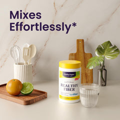 Healthy Origins Natural Healthy Fiber container with glass of water citrus and kitchen props fiber supplement for gut health