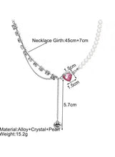 Crystal bar and pearl heart pendant necklace with pink heart center and drop charm