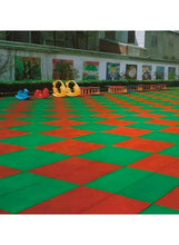 Interlocking sports floor mat tiles with red and green checker pattern, shock-absorbent