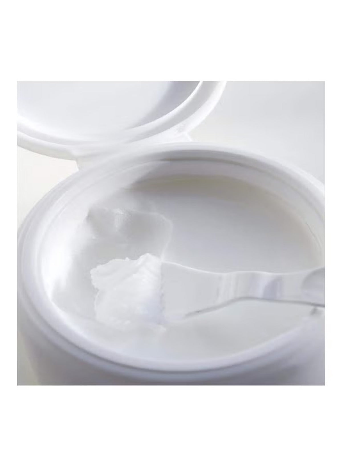 Heimish hydrating cleansing balm for all skin types in a jar with a spatula for easy application