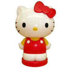 Hello Kitty coin bank figurine with red bow and red dress, holding a coin slot