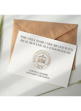Printed paper insert card with Kew seal and hair care brand wording