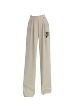 Beige high-rise lightweight pants with pleated front and wide straight legs