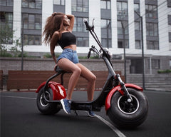 Winner sky high speed urban electric scooter in black and red with woman posing outdoors
