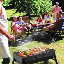 Outdoor charcoal grill with front vents and cooking grate, food grilling with smoke