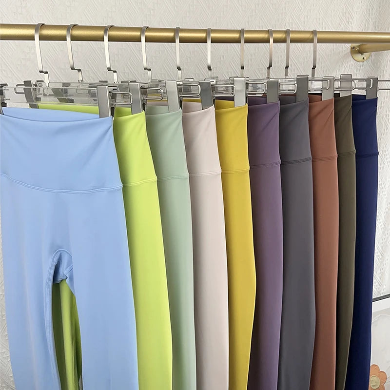 Mumzar high waist push up leggings for women in various colors hanging on display