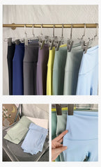 Mumzar high waist yoga leggings UAE in various colors hanging for versatile workout styles