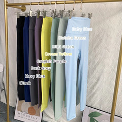 Mumzar high waist yoga leggings UAE in various colors displayed on a rack