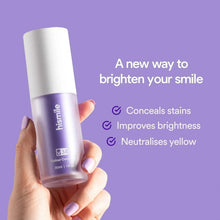 Hismile v34 colour corrector purple whitening bottle held in hand