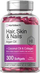Clear bottle of pink softgels labeled hair skin and nails vitamins with biotin 300 softgels coconut oil collagen