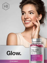 Hair, Skin & Nails supplement bottle beside a smiling woman