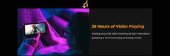 HOTWAV W11 rugged phone held horizontally by person watching video on couch with purple lighting 35 hours playback