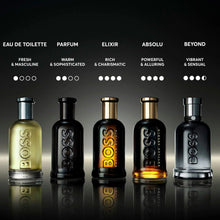 Set of five parfum bottles with black and gold tones, embossed lettering on glass.