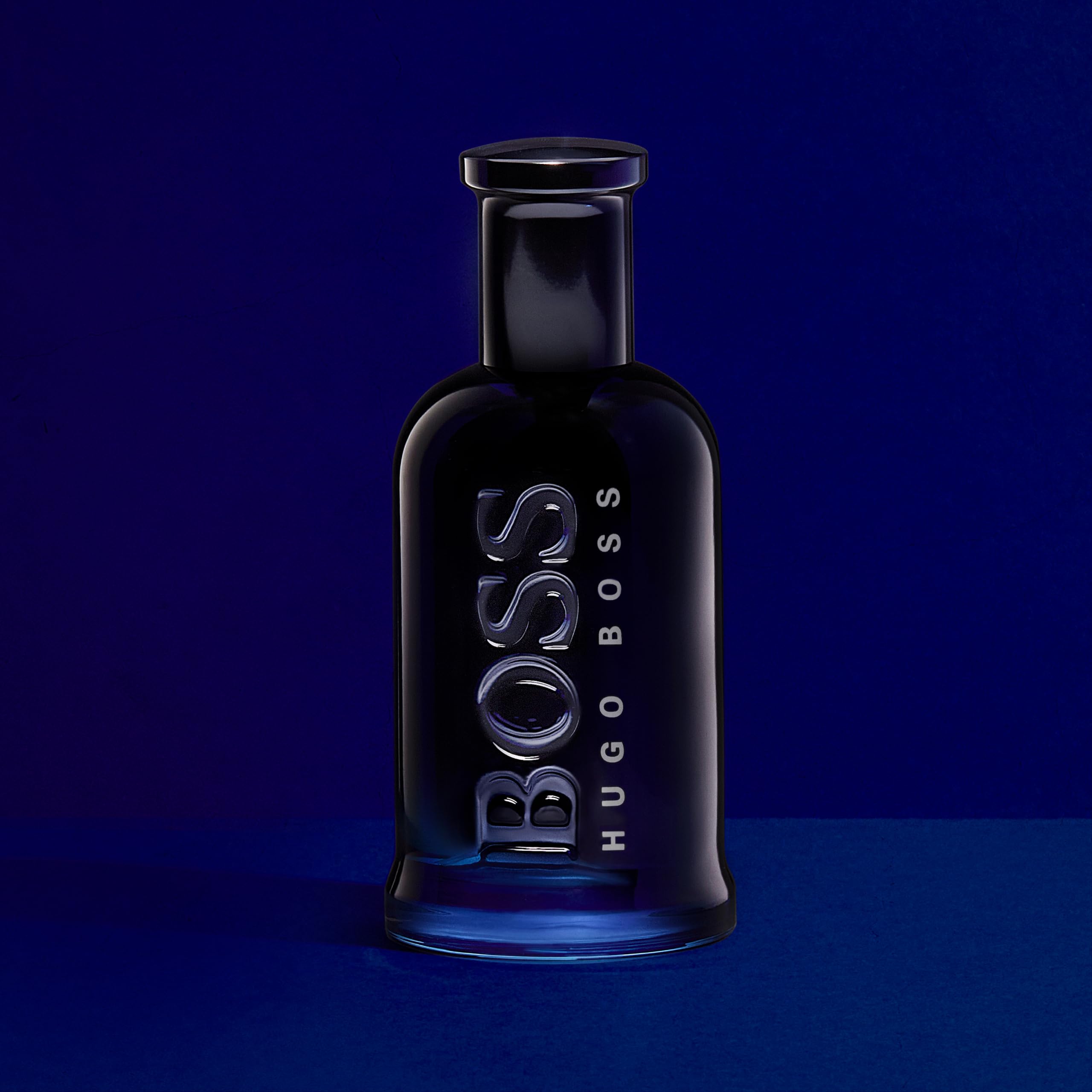 Hugo Boss Eau De Toilette 100ml price black glass bottle with sleek design on blue background
