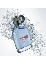HUGO EXTREME perfume bottle with water splash and bubbly droplets, silver ridged cap