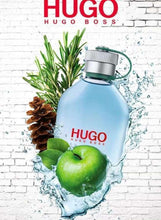 HUGO perfume bottle with green apple and water splash on display