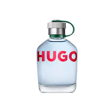 HUGO eau de toilette bottle, silver cap with green loop, light blue glass