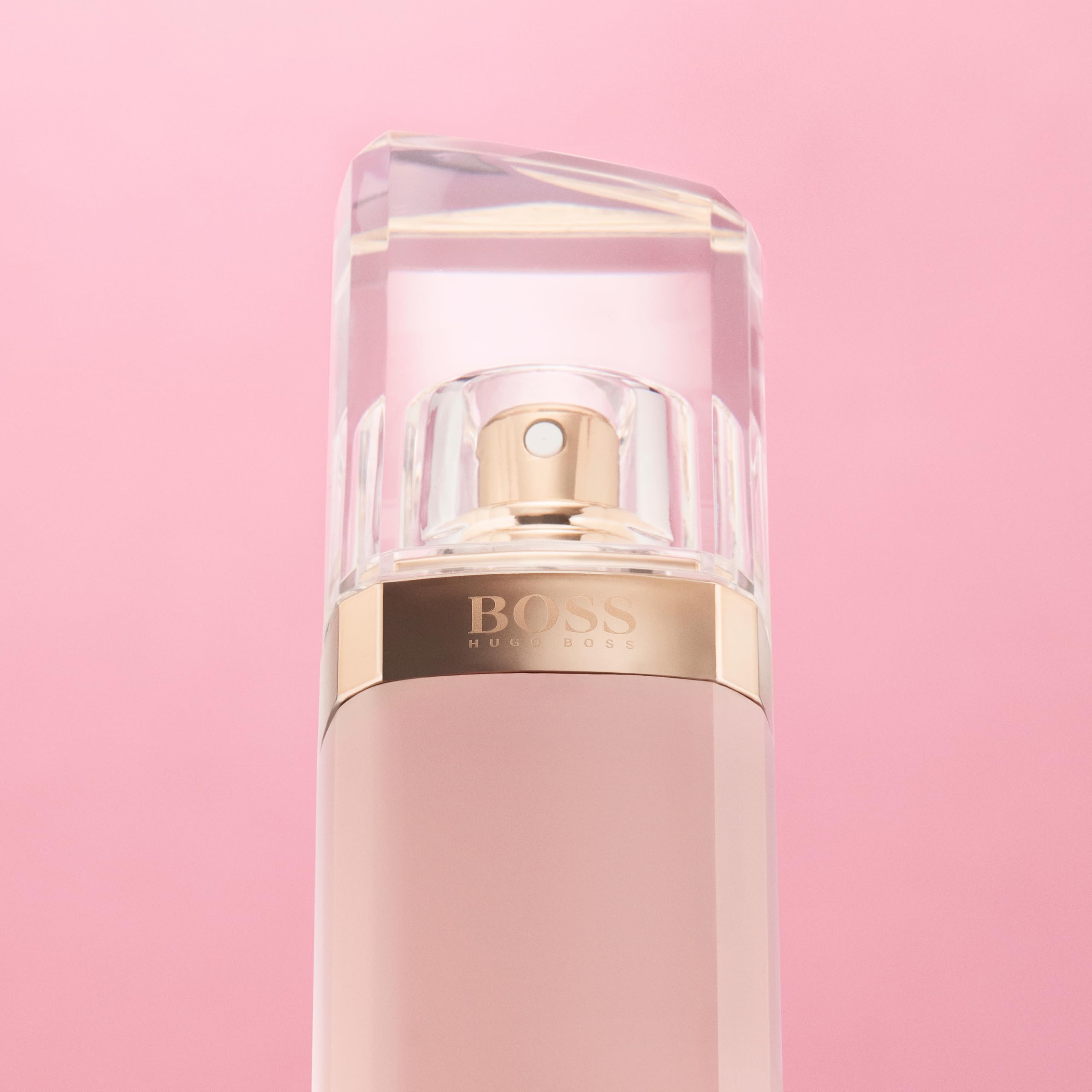Hugo Boss Ma Vie for women perfume bottle with clear cap and gold spray on pink background
