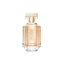 Striped glass eau de parfum bottle with gold spray cap