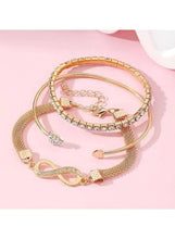 Gold-tone bracelet set with infinity charm and crystal bangles, stacked set of three