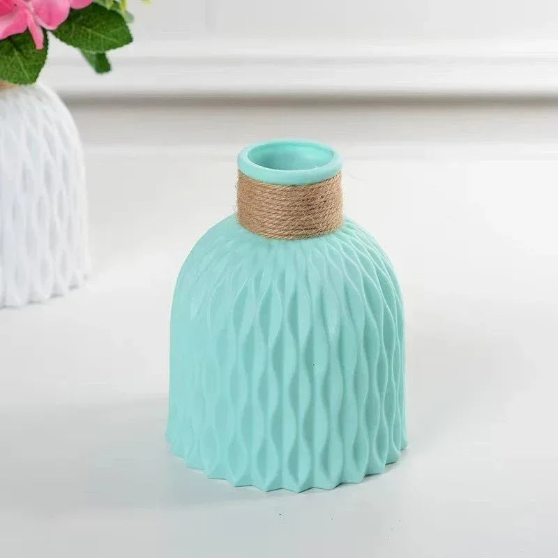 Ribbed plastic flower vase with twine wrap, teal finish, wide round opening.
