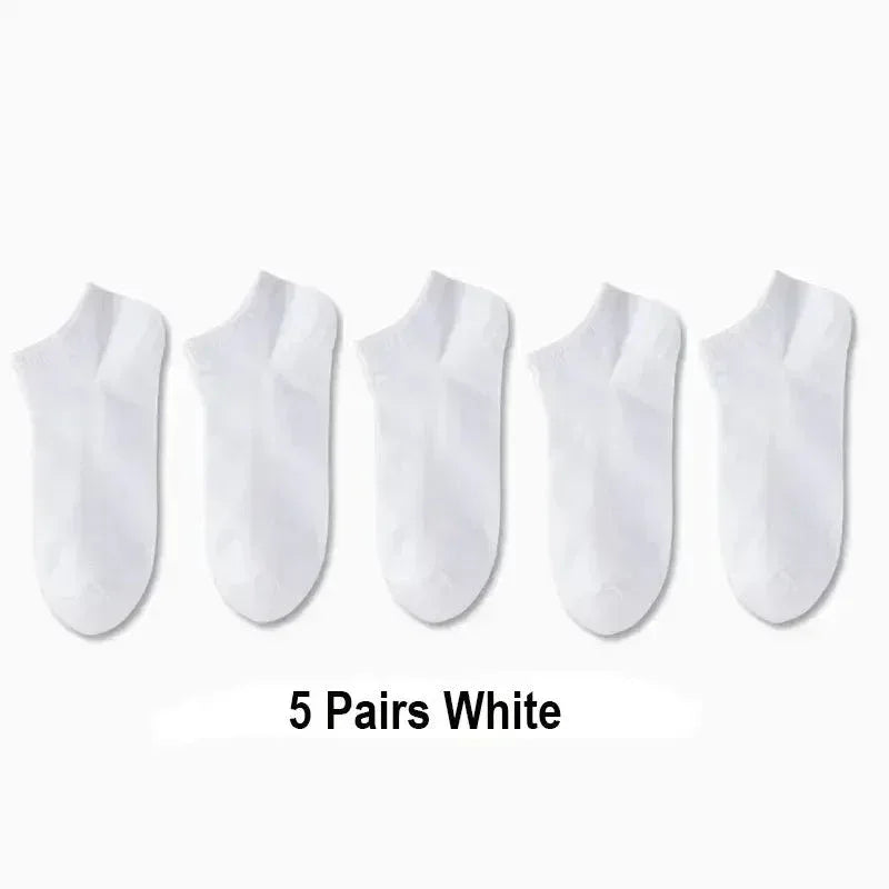Set of plain white boat socks, five pairs shown in a row