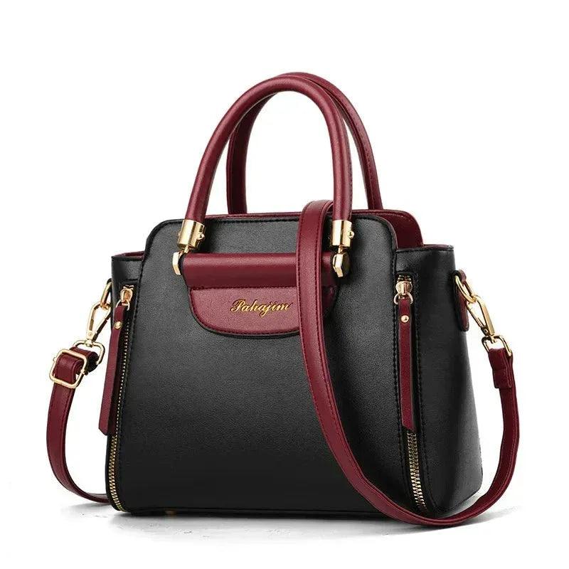 Color-block shoulder bag with burgundy flap and black body, gold hardware, shoulder strap