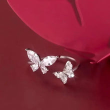 Silver-tone crystal butterfly ring, close-up of butterfly motifs with clear stones