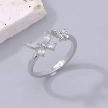 Silver crystal butterfly ring with three butterfly stones on a light band