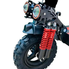 Electric scooter front suspension with red springs and headlight housing