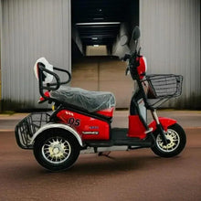 Red electric trike scooter with front basket and gray seat cover, rear fender detail.
