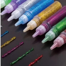 Assorted glitter glue tubes with colored glitter tips in blue, purple, gold, pink, green