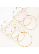 Gold tone hoop bangle bracelet set with beaded ball details along the rings