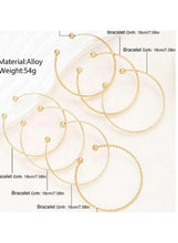 Gold tone thin bangles with beaded spheres on open circle hoops